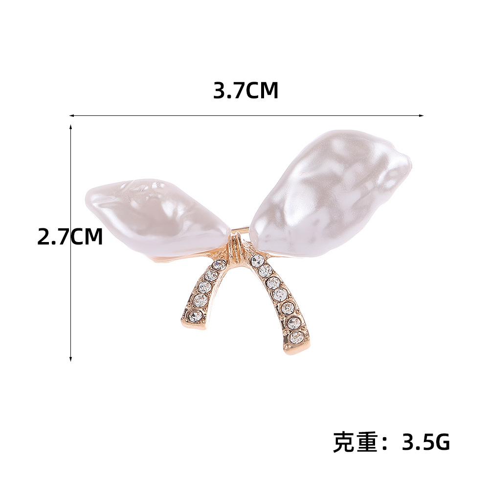 

Temperament Diamond Bow Brooch Light Luxury Niche Design Pin Shirt Suit Anti-light Accessories світло-фіолетового кольору