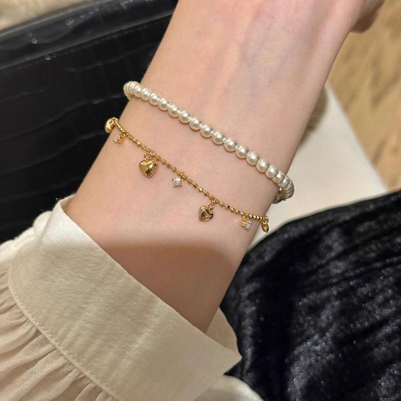 Elegant French Retro Heart Tassel Diamond Pendant Bracelet - High-End Fashion for Women.