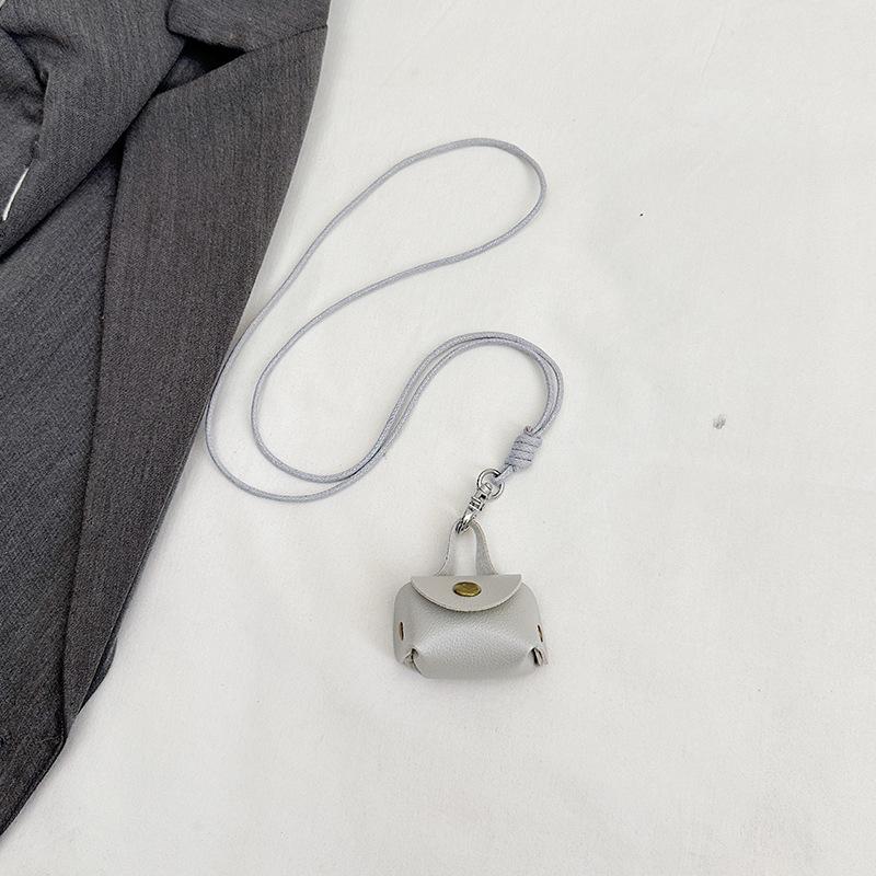 This year, it is super popular. Leather earphones, bags, neck hanging, hand carrying women's mini storage accessories, small bags, pendant keychains.