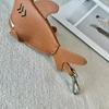 New leather dolphin change bag, keychain pendant, cute fashion earphones, lipstick storage bag.