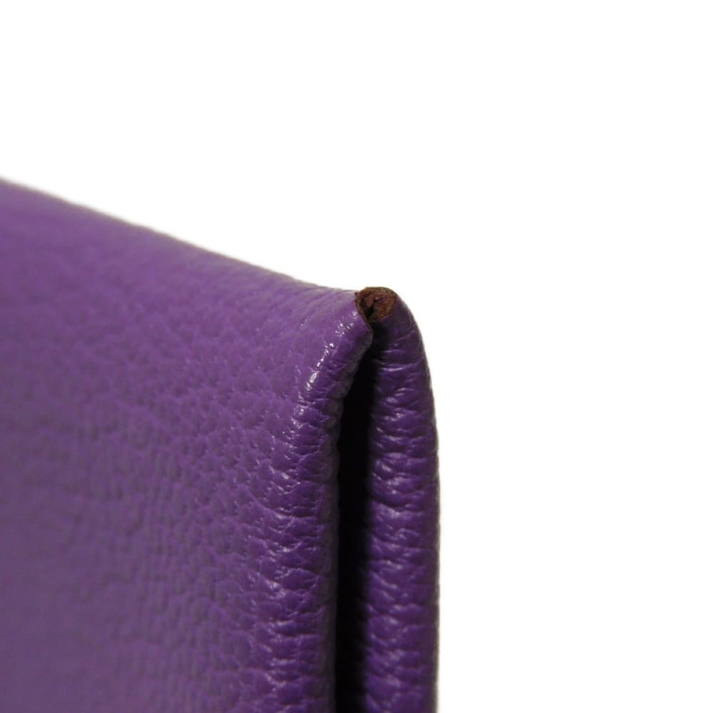 Used 9212 Calvi 7946 Chevre Mysore Goatskin Bag with Gold-stamped Logo and Purple Snap Buttons. Excellent Condition.