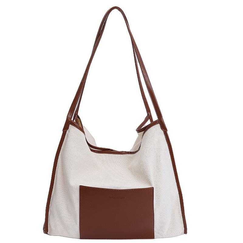 

Japanese lazy canvas bag autumn and winter new large-capacity splicing contrast shoulder bag casual simple bucket bag коричневый