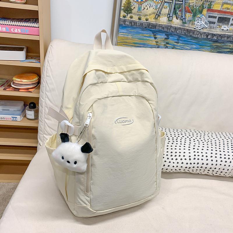 Simple Solid Color Letter Embroidery Student Backpack With Plush Pendant For Middle School Students