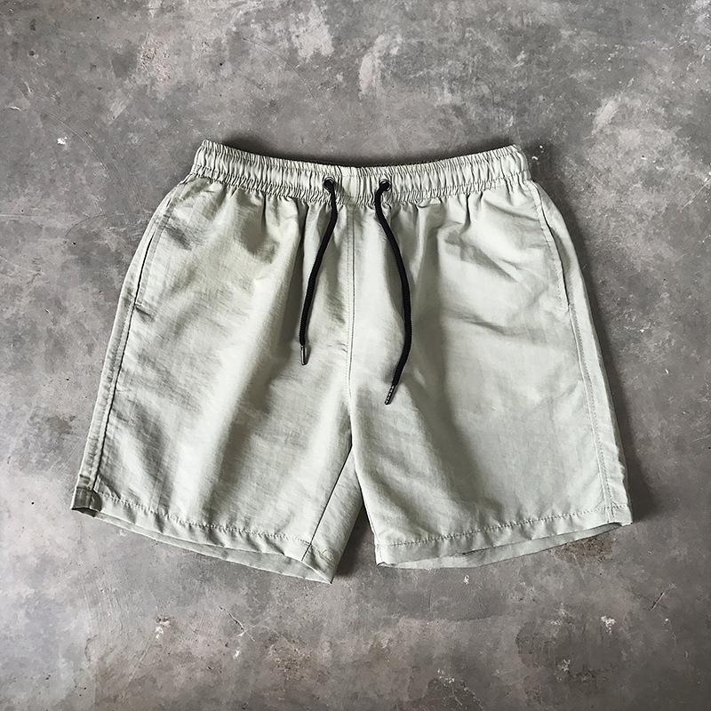 Letnie męskie spodenki casualowe Cukierkowe kolorowe spodnie Five Quarter męskie sportowe luźne szybkoschnące cienkie spodnie plażowe spodenki męskie