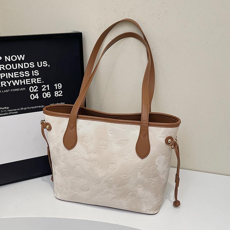 Frühlingsneues Produkt, niedliche geprägte Tragetasche, Studenten-Pendler-Nische, Damen-Schultertasche mit großem Fassungsvermögen