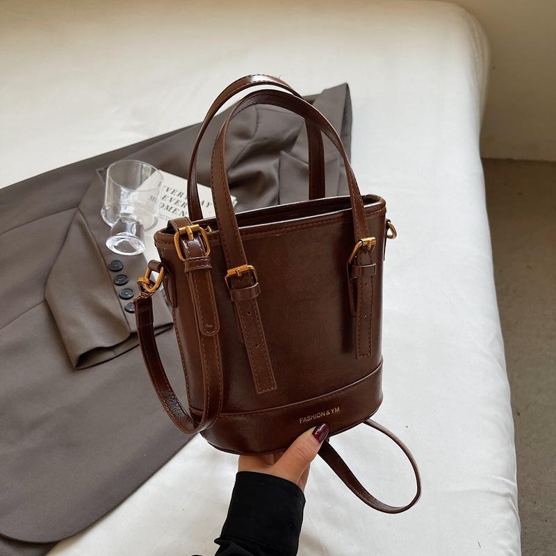 

2025 new fashion foreign style Korean hand carrying bucket bag simple casual versatile commuter shoulder messenger bag women