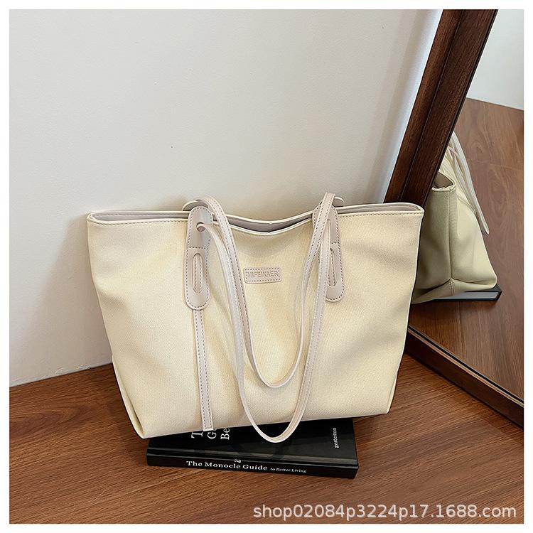 

2025 new solid color simple retro large capacity versatile class student commuter leisure bag shoulder bag