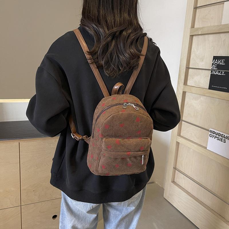Schoolbag retro corduroy backpack women's 1011 new Korean version simple casual large capacity strawberry print commuter backpack