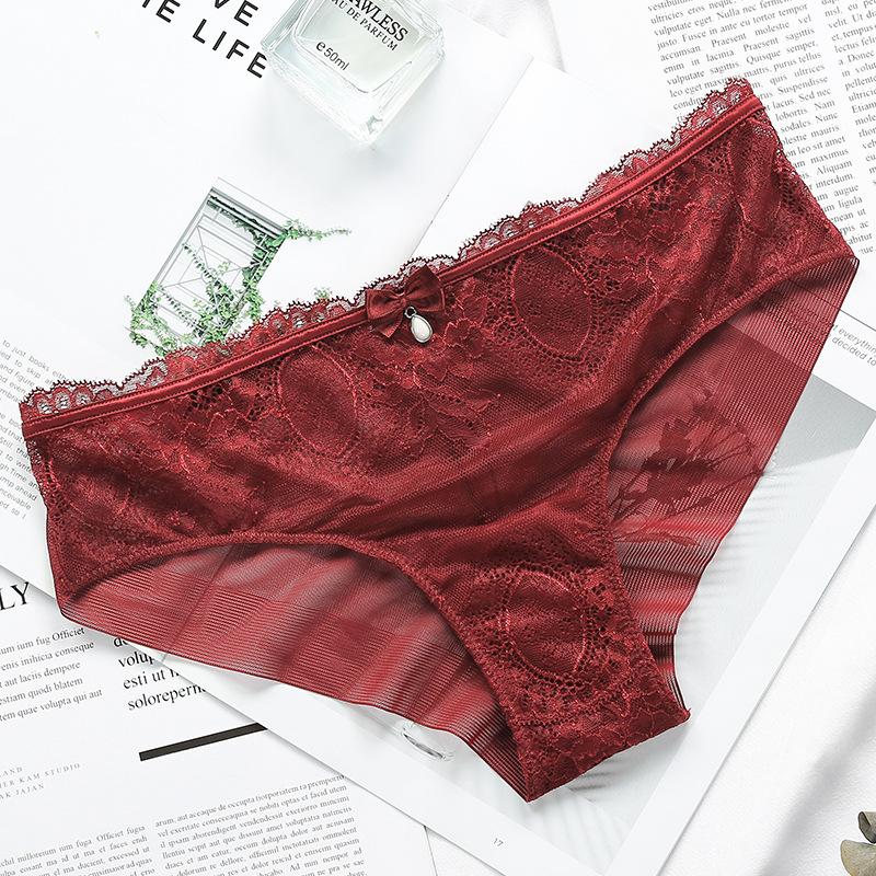 Ropa interior de encaje estilo europeo y americano con entrepierna de algodón ahuecada transpirable de talle medio para mujer