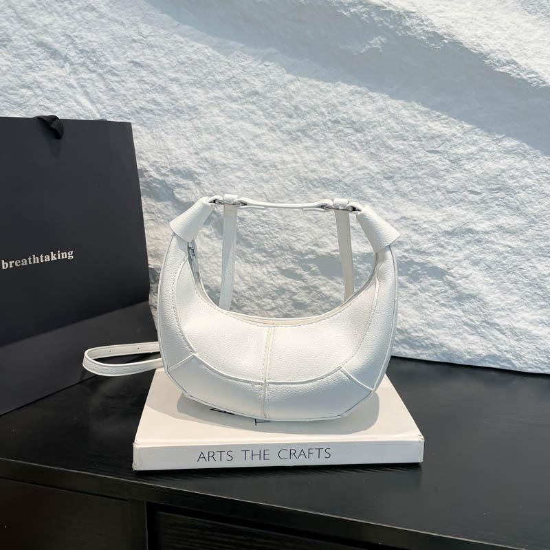 

High-end niche design crescent moon bag women s new personalized splicing hand bag shoulder messenger bag белый