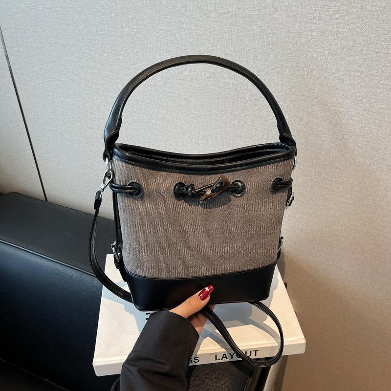 Premium sense simple retro bucket bag women's 2025 summer new messenger bag casual portable shoulder bag