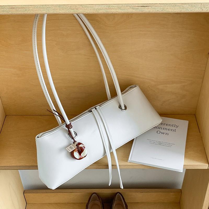 

2025 Cross-border New French Pure Color Fashionable One-shoulder Bag Women s Niche Design High-end Armpit Stick покинуть белый