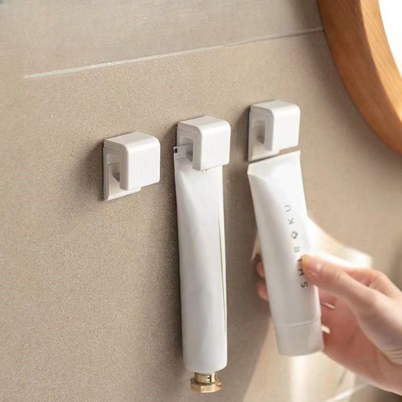 Toothpaste Holder - Wall-mounted Bathroom Storage Hook Without Drilling - Simple Design for Washbasin - Compact Toothpaste and Soap Rack