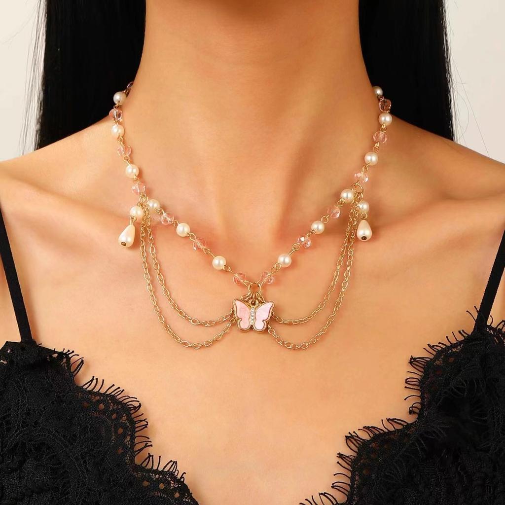 Spezialinteresse Design Heißes Mädchen Imitation Perle Quaste Liebe Kreuz Schmetterling All-Match Halskette