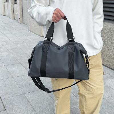 A Large-capacity Water-resistant Travel Bag Carried By A Man, A Single-shoulder Crossbody Luggage Bag and A Storage Bag