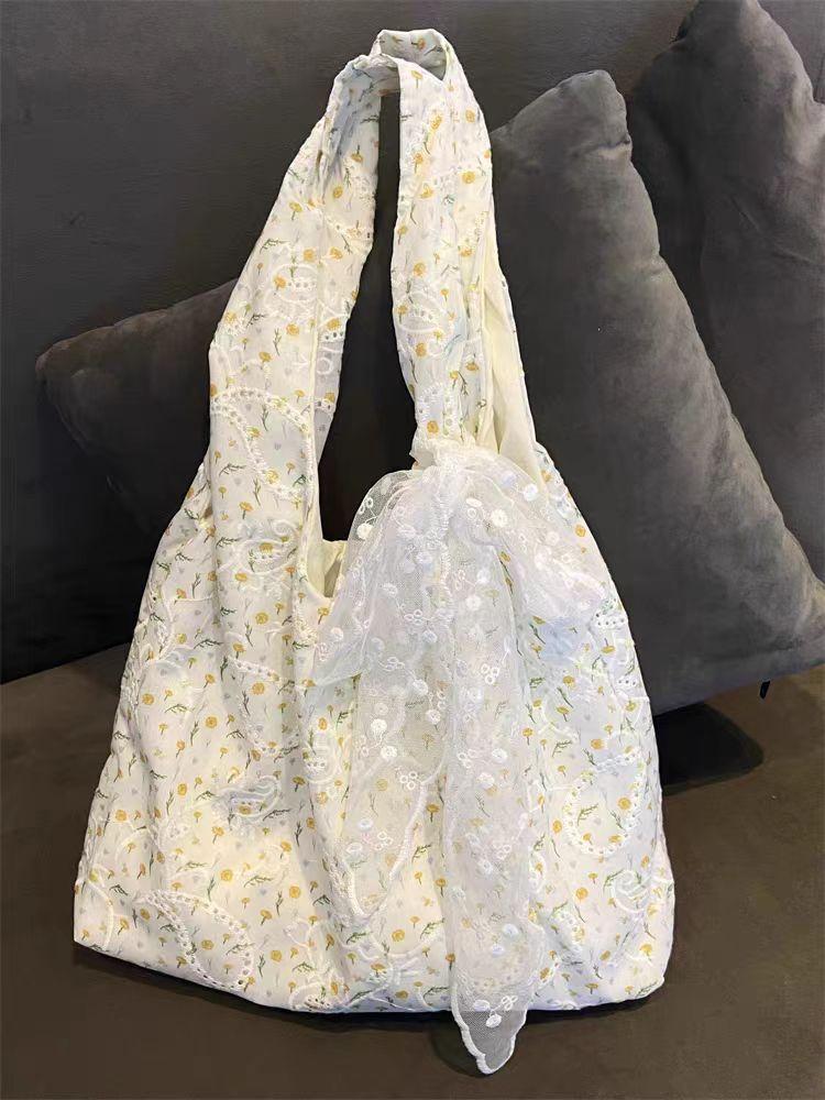 Niche broken flower canvas bag women's new large-capacity commuter shoulder bag, versatile texture
