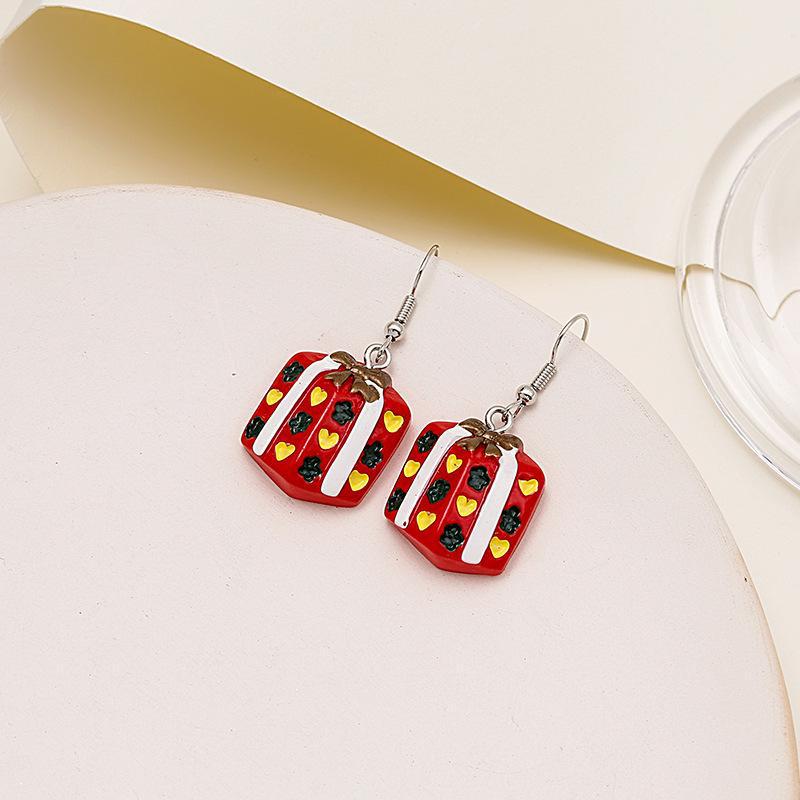 Färgglada tecknade jultomte- och renörhängen