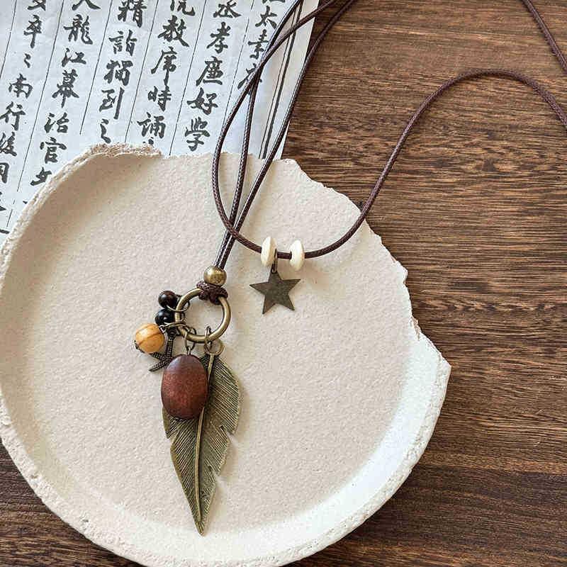 New Chinese leather pendant, fringed necklace, female ethnic style, niche retro sweater chain, fashion and high-end item jewelry.