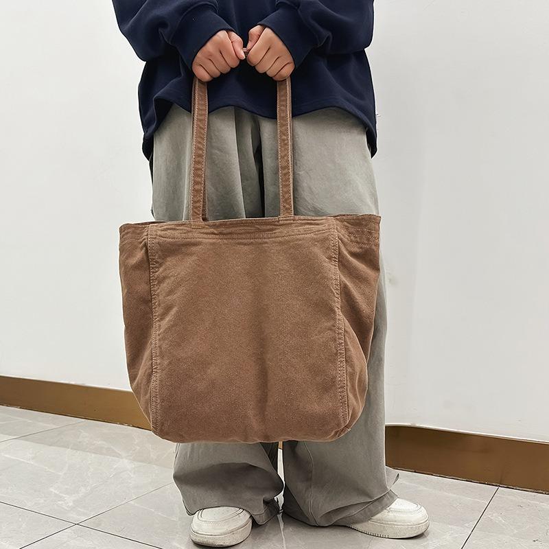 Lazy wind canvas bag, new large-capacity commuter tote bag, casual versatile shoulder bag, portable shopping bag.