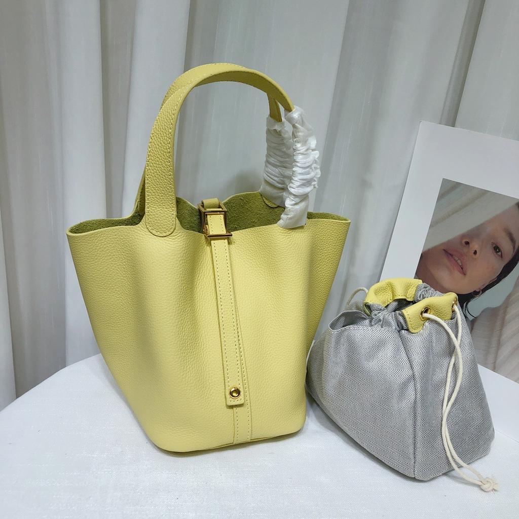 Spot wholesale top layer cowhide vegetable basket bag leather bucket bag commuter fashion lock buckle hand-held handbag woman