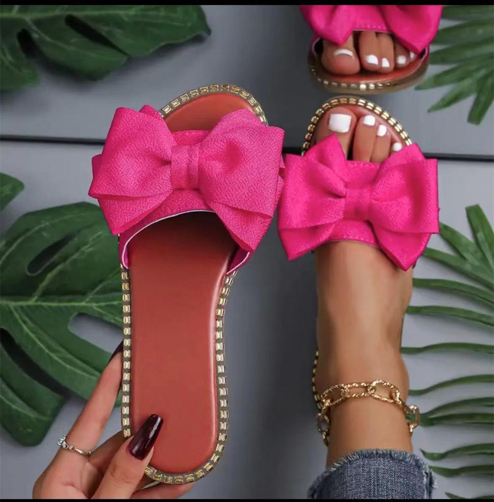 New flat-bottomed rhinestone bow one-word slippers for women to wear solid color light cloth cool slippers 2025