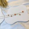 Elegant Five-Flower Double-Sided Four-Leaf Clover Stainless Steel Necklace with Tassel Pendant