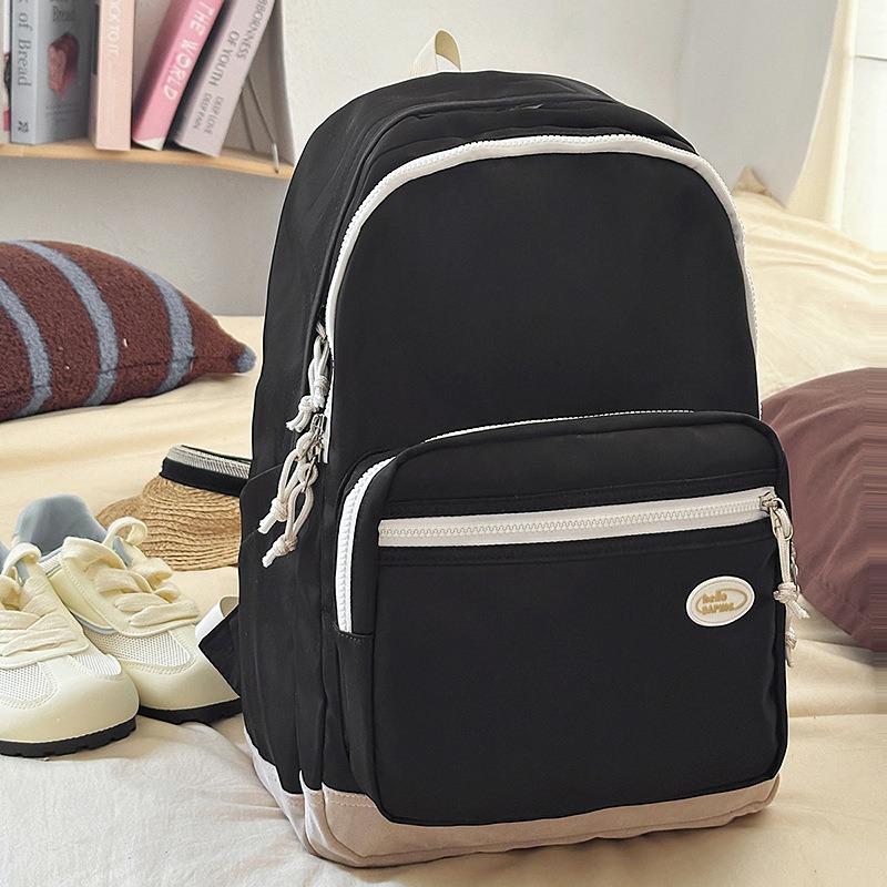 

Casual solid color men s and women s backpacks New travel lightweight computer backpacks High school schoolbags Junior high school чорний