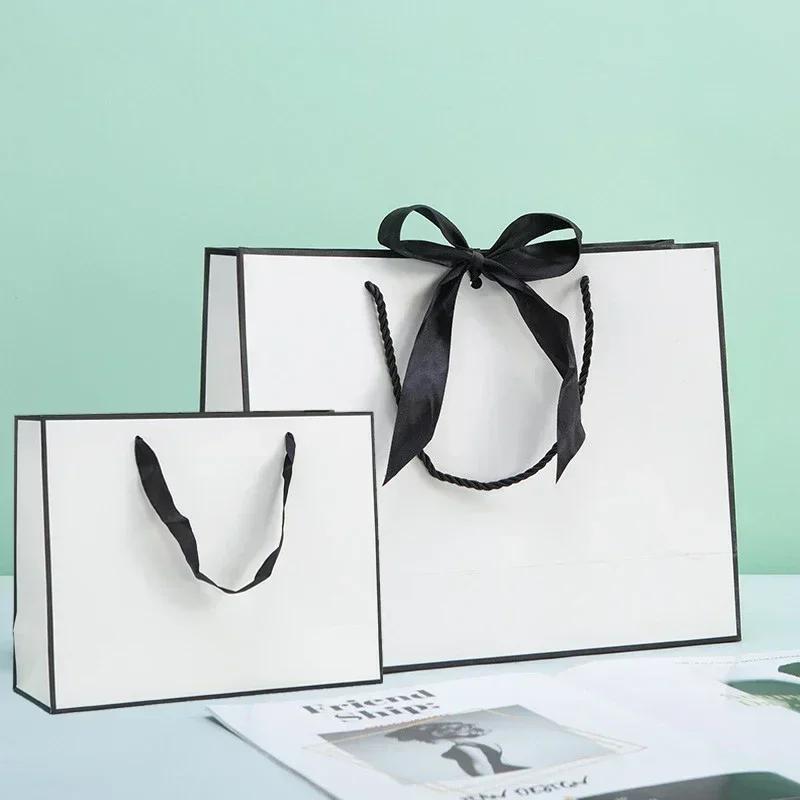 White Paper Jam Handbag Kraft Paper Thick Waterproof Frame Rivet Handle Gift Bag Cosmetic Clothing Store Portable Packaging Bags