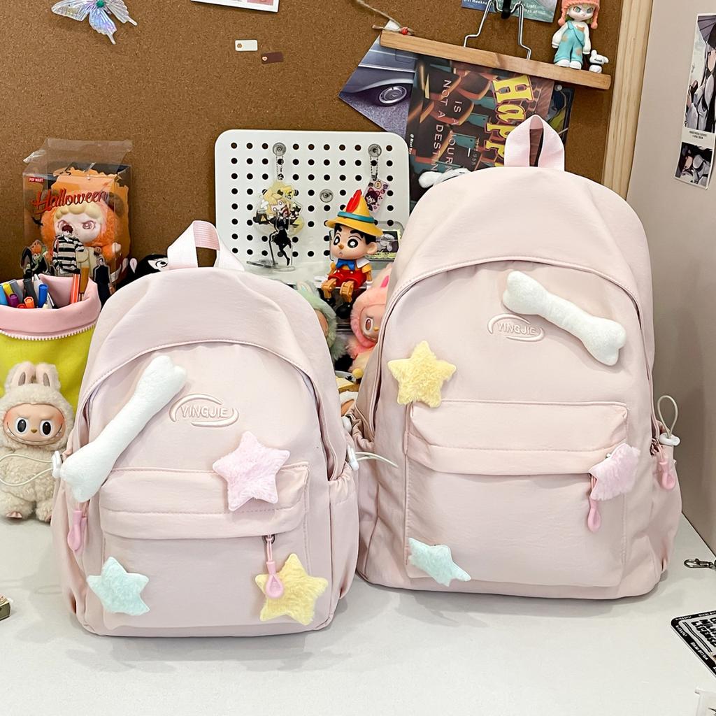 Solid color simple casual backpack female niche design sense lightweight size backpack class primary and secondary school students schoolbag