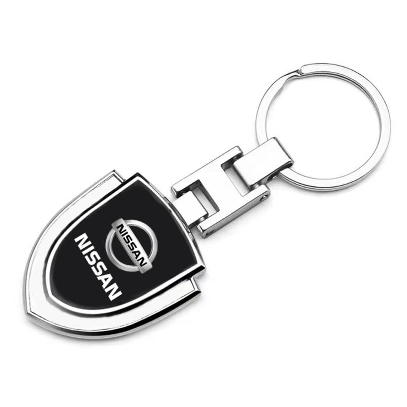 1Pcs Car Emblem Stying Metal Key Rings Shield Shaped Keychain for Nissan Nismo GTR Altima Qashqai Almera Navara