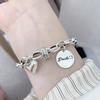 Japanese-Korean Niche Love Heart Bracelet for Women: S925 Silver-Plated Simple Letter Round Tag Bangle, Trendy Student Jewelry.