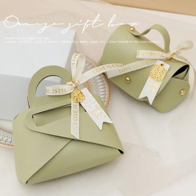 Verpackungsbox Schleifenband Henkeldesign Handtaschenform Kunstleder Hochzeitsgeschenke Geschenk Süßigkeitentüte Haushaltsaccessoires