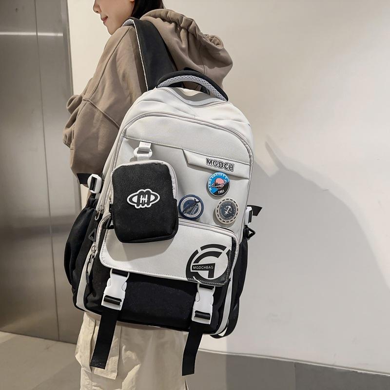 Stylish and Exquisite Contrasting Color Badge Large-capacity Backpack 24 New Primary School Junior High School Boys and Girls Schoolbag
