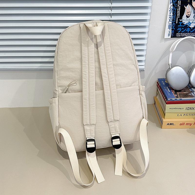 Schoolbag casual large-capacity backpack girls Korean version solid color simple college student schoolbag high value light casual backpack