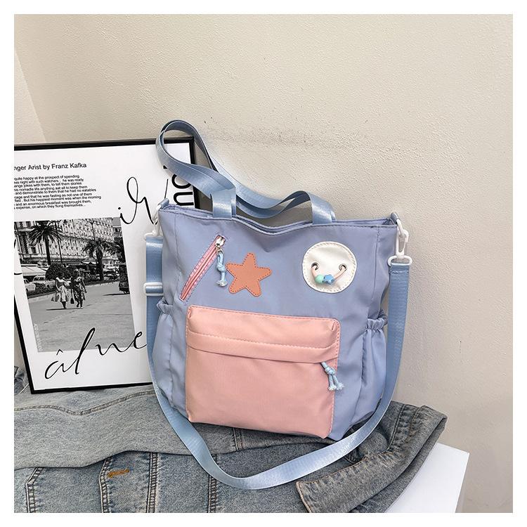 New splicing contrasting color handbag, class commuting shopping tutoring shoulder bag, light literary and artistic burden reduction messenger bag