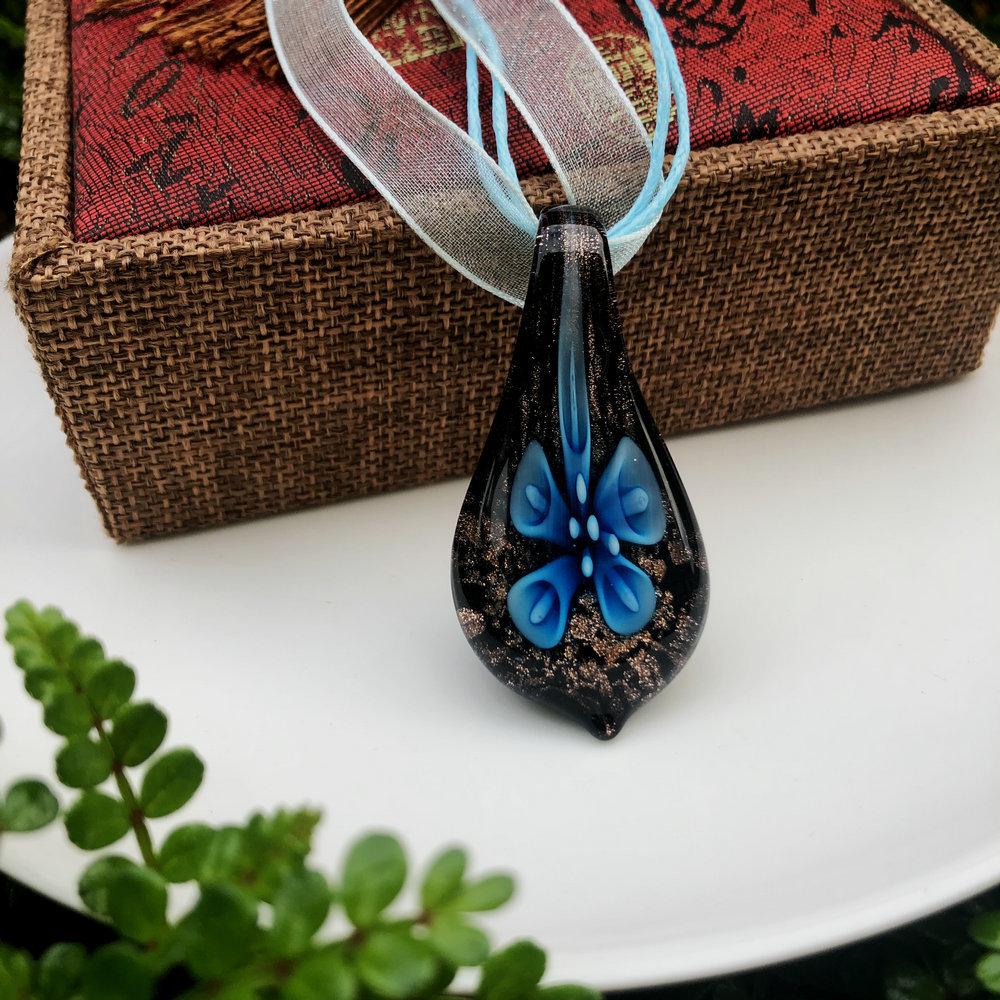 Trendy Blue Glass Ribbon Pendant Necklace & Earring Set - Perfect Seaside Vacation Accessory.