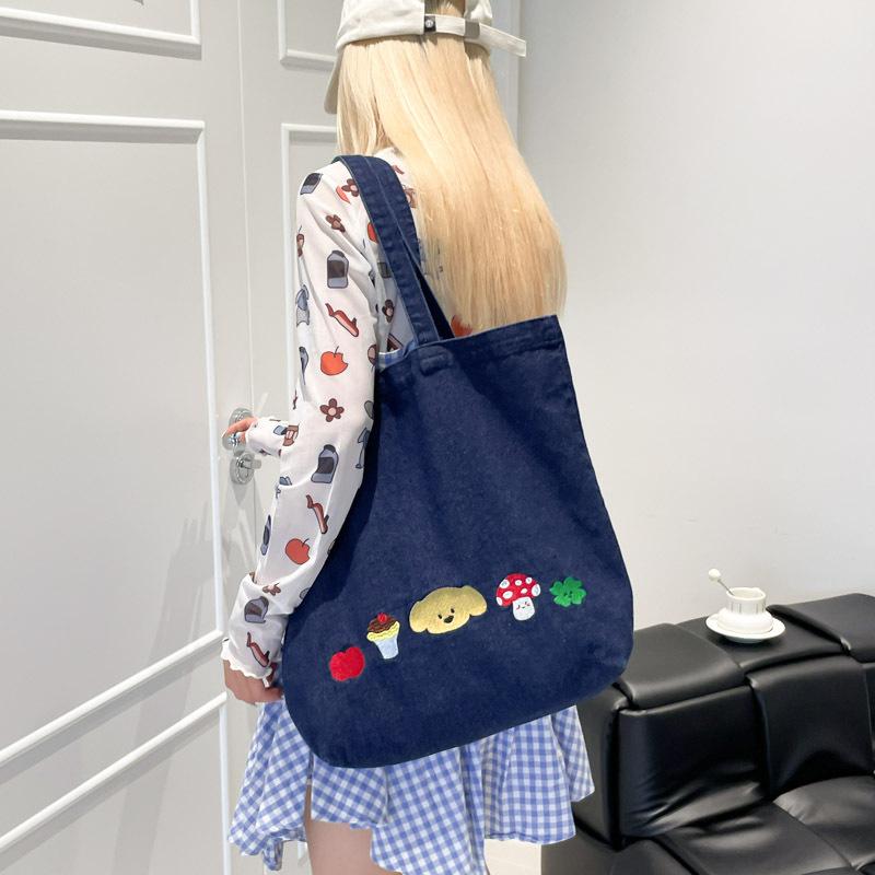 Casual canvas bag design sense niche women's bag 2025 new cartoon printed tote bag large capacity shoulder bag