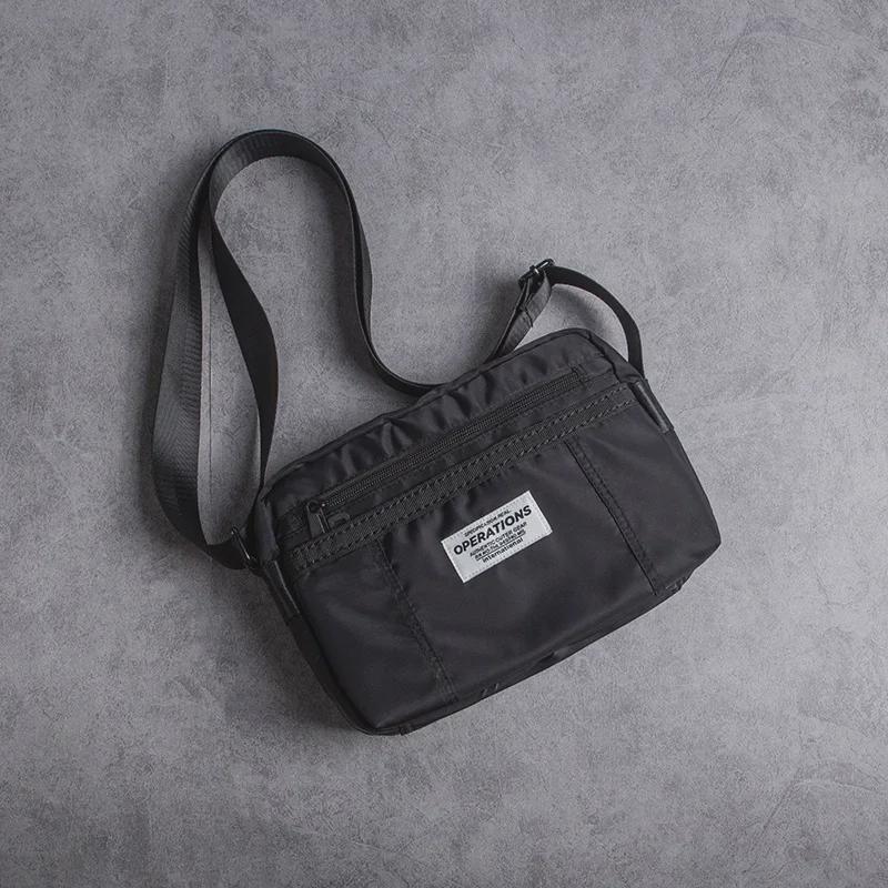 Herren Oxford Stoff Lässige Messenger Umhängetasche: Neuer Trend in der amerikanischen Street Fashion.