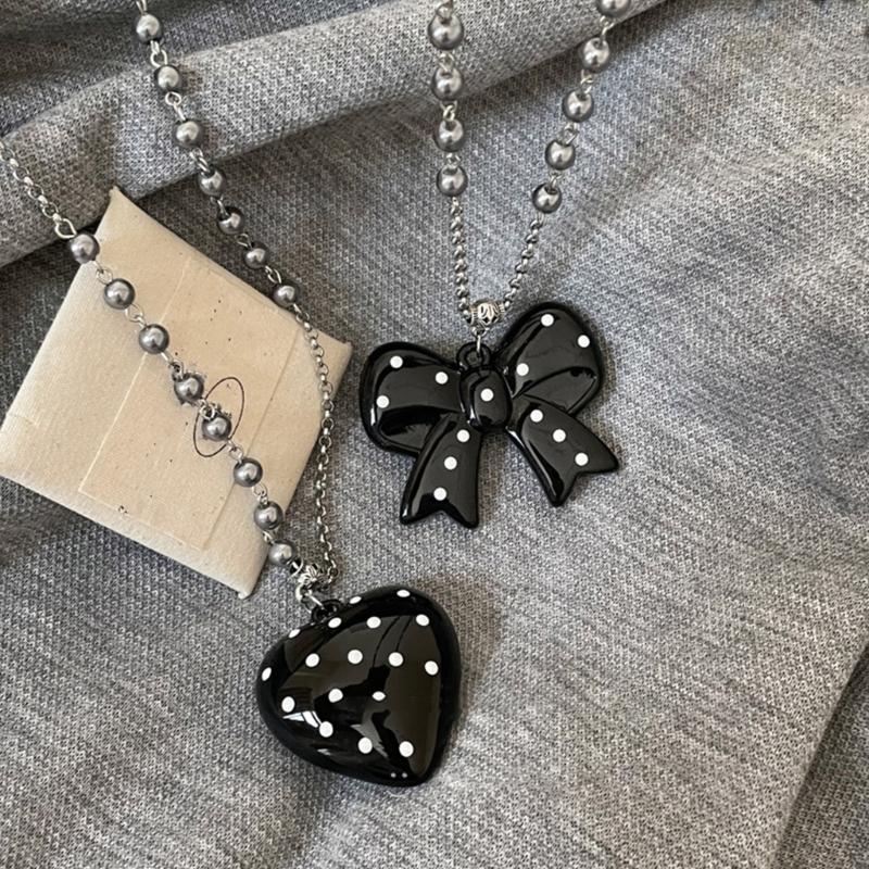 Stylish Long Beaded Necklace Featuring Black Round Dots And Bowknot Love Charm For Casual or Party Wear