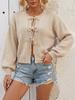 2026 solid color autumn and winter European and American style lace-up bow jacket sweater women's round neck commuting cross-border knitted cardigan