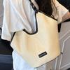Large capacity beach woven bag women's 2025 new spring and summer niche design single shoulder commuter straw woven tote bag