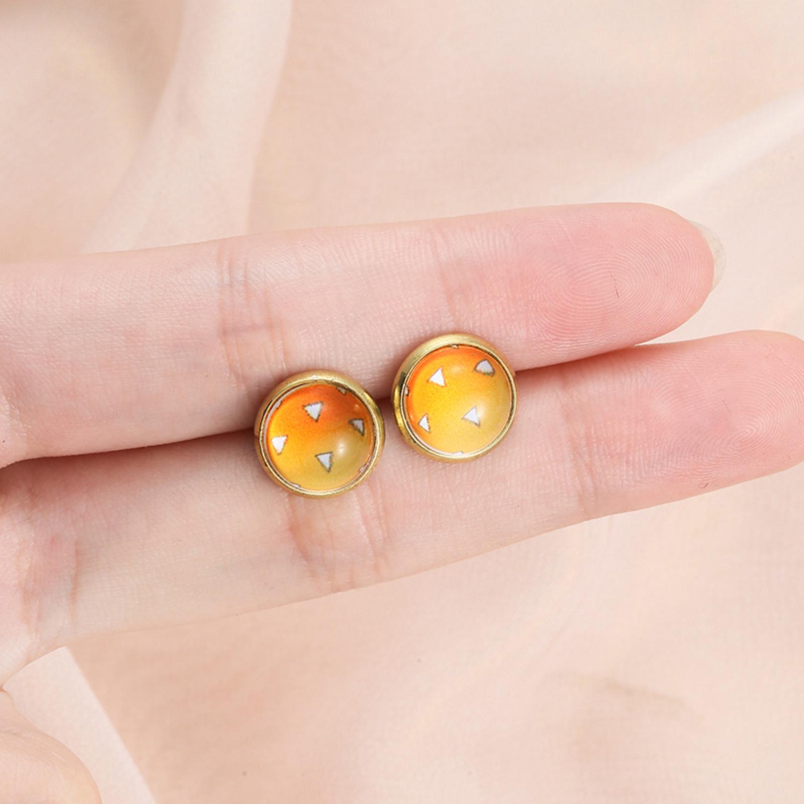 

Round Button Style Stud Earrings with Geometric Triangle Pattern in Resin Dome and Metal Base for Everyday Wear and Special Occasions