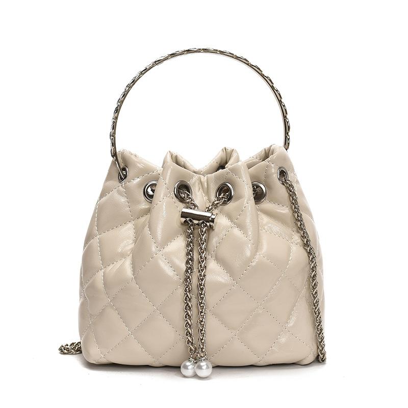 Beliebte Großhandelsnische Freizeit Rautenmuster tragbare plissierte Eimertasche Koreanische Mode vielseitige leichte Luxus Ketten Umhängetasche