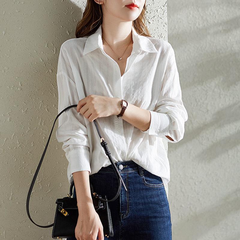 Chemise en coton blanc à manches longues pour femmes Au printemps et en automne Design polyvalent ample et élégant Haut de niche