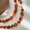 Stylish Red Resin Irregular Bead Necklace With Adjustable Length For Personalized Fit And Artistic Design In Sturdy Alloy Construction.