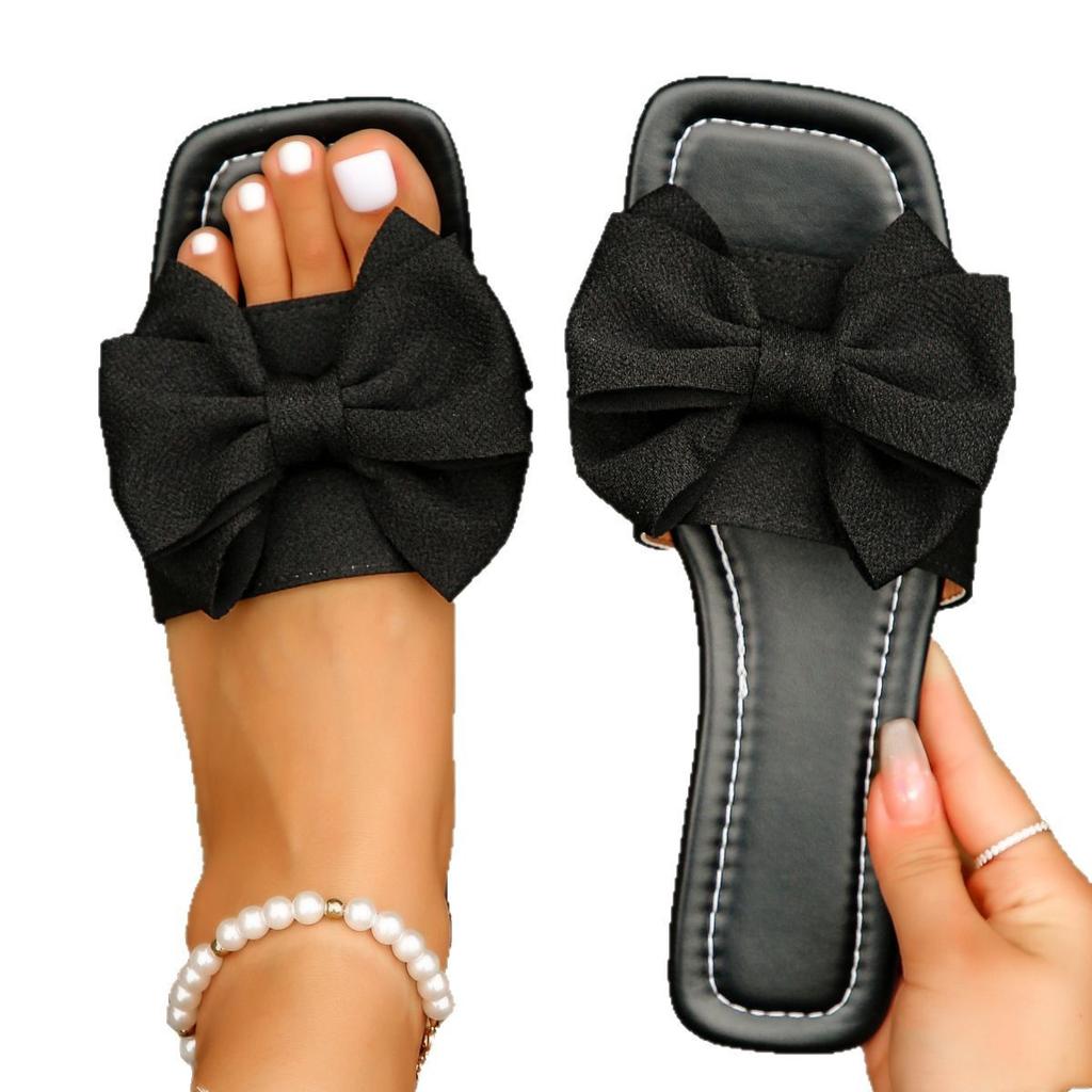 2025 Sommer neue modische vielseitige Schleife Ein-Wort-Slipper große Größe lässige flache Slipper Damen