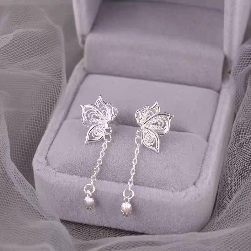 Hollow Lotus Seed Butterfly Tassel Earrings: Women s New Chinese Style, Luxurious Summer 2025 Niche Design.