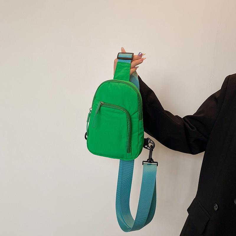 Solid color light and simple going out portable casual mobile phone bag sports shoulder messenger bag breast bag men and women