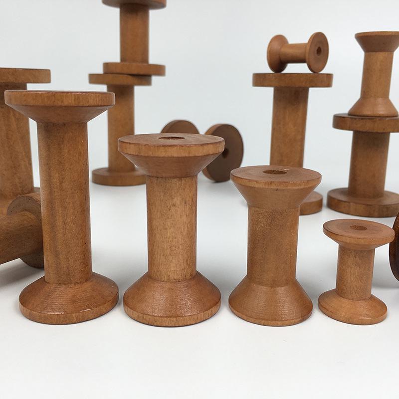 Retro Solid Wood Spool: Nostalgic Handmade Thread Organizer for Cross-Stitch and Crafting.