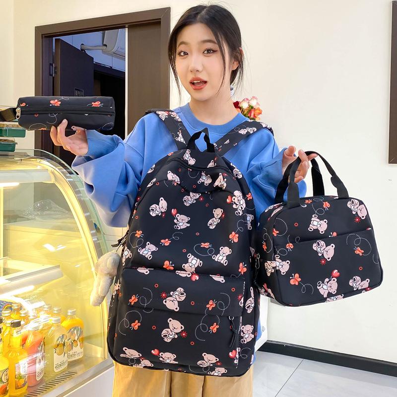 School bag new cute cartoon nylon backpack women's large-capacity middle and high school burden reduction wear-resistant school bag three-piece set